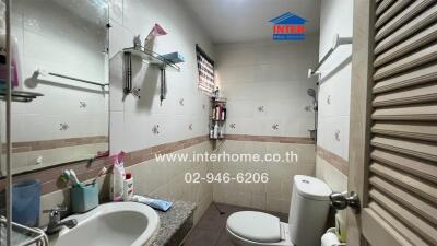 Spacious bathroom with modern amenities in a real estate property