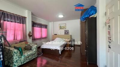 Spacious living room with natural light and comfortable furnishings