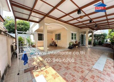 Spacious covered patio in residential home with tiled flooring