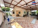 Spacious covered patio in residential home with tiled flooring