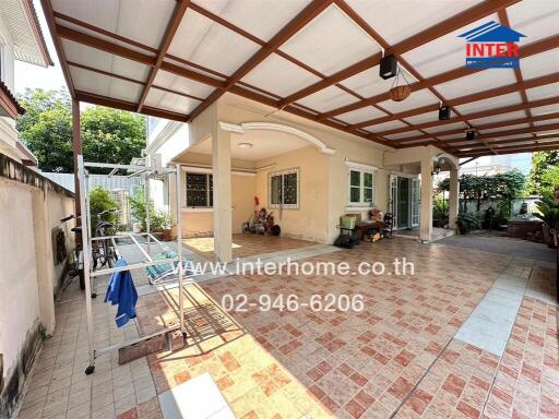 Spacious covered patio in residential home with tiled flooring