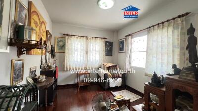 Spacious and well-lit living room with traditional decor