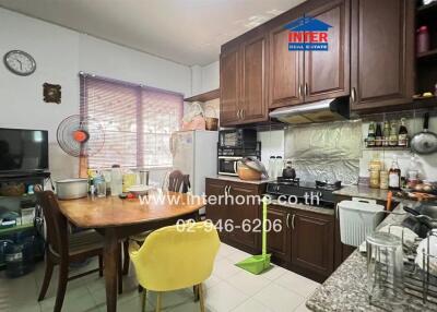 Spacious kitchen with wooden cabinets and modern appliances