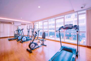Modern residential gym with various exercise equipment