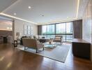 Spacious modern living room with elegant furnishings and ample natural light
