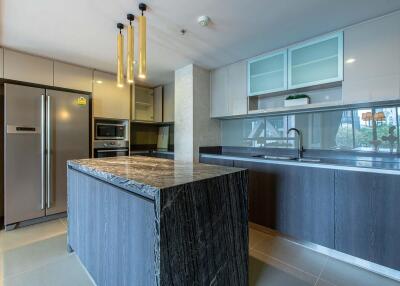 Modern kitchen with integrated appliances and center island
