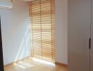 Bright bedroom with wooden blinds and natural light