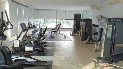 Spacious modern home gym with various fitness equipment