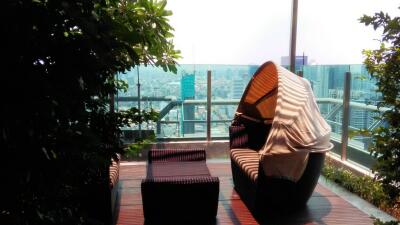 Modern balcony with outdoor furniture and cityscape view