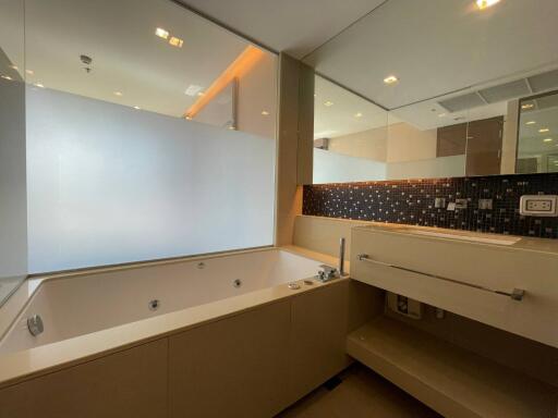 Modern bathroom with bathtub and vanity area