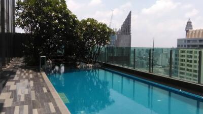 Rooftop infinity pool overlooking a city skyline