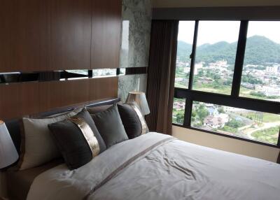 Modern bedroom overlooking scenic mountains