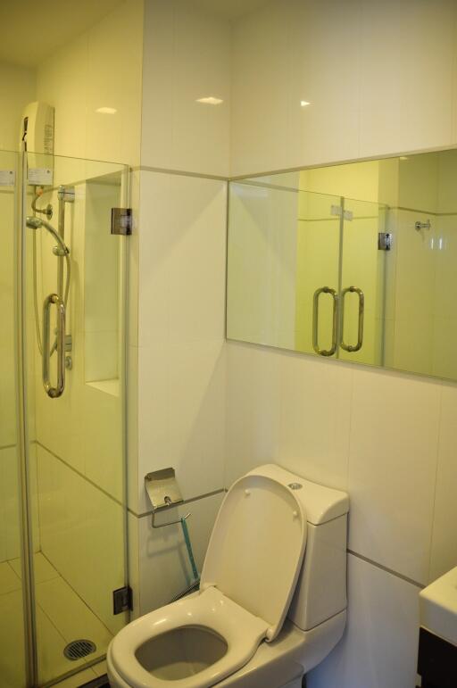 Modern compact bathroom with glass shower enclosure
