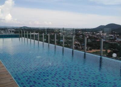 Luxurious infinity pool overlooking expansive cityscape