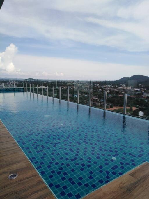Luxurious infinity pool overlooking expansive cityscape