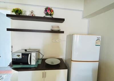 Compact kitchen corner with storage and appliances