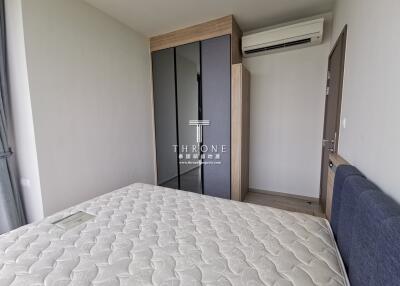 Modern bedroom with a large bed and built-in wardrobe