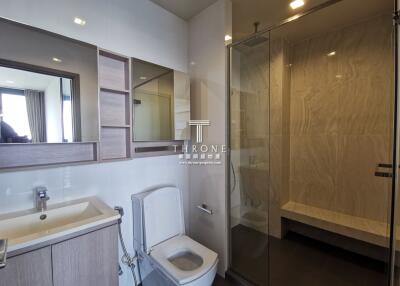 Modern bathroom with shower, toilet, and vanity