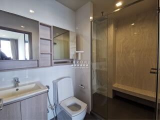 Modern bathroom with shower, toilet, and vanity