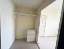 Empty bedroom with built-in closet and natural light