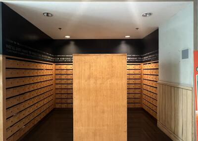 Spacious lobby area with wooden mailboxes