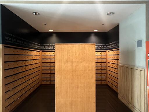 Spacious lobby area with wooden mailboxes