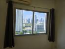 Bedroom window view overlooking the city skyline