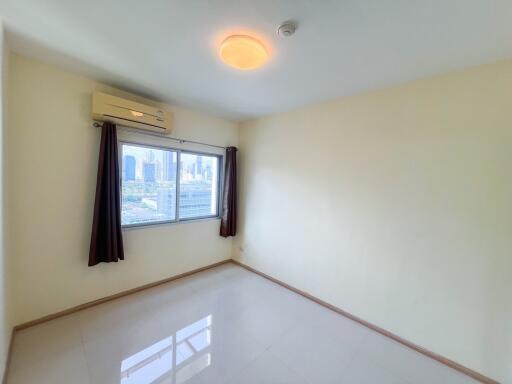 Bright bedroom with city view and air conditioning