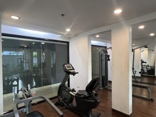 Modern home gym with various exercise equipment