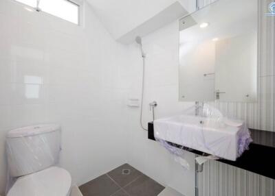 Modern white bathroom with shower and sink