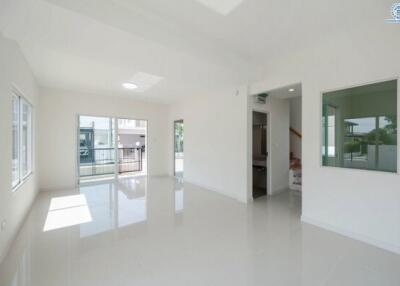 Spacious and bright living room with glossy white floor