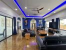Spacious modern living room with hardwood floors and blue accent walls