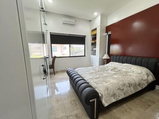 Spacious modern bedroom with stylish decor