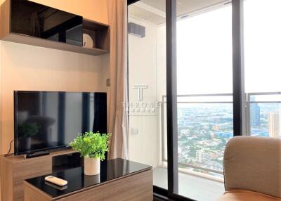 Modern high-rise apartment living room with city view