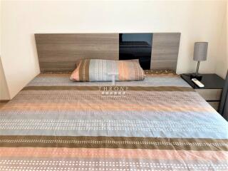 Modern bedroom with well-decorated bed and sleek nightstand