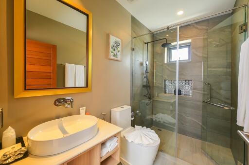 Modern bathroom with glass shower and stylish vanity