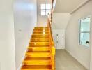 Bright and polished wooden staircase in a modern home