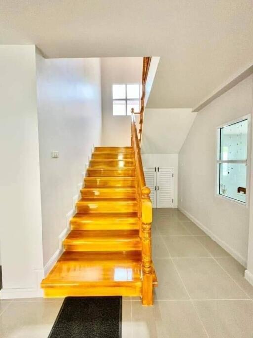 Bright and polished wooden staircase in a modern home