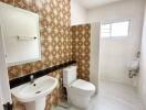 Modern bathroom with vintage patterned tiles and white fixtures