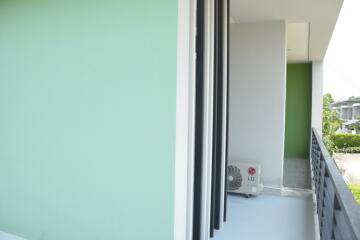 Modern balcony with blue sky and air conditioning unit