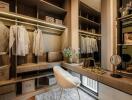 Elegant walk-in closet with custom shelving and seating area