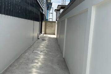Narrow alleyway between modern building structures under construction