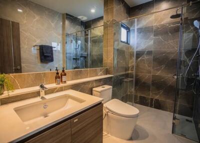 Modern bathroom interior with marble tiles and contemporary fixtures