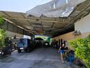 Spacious covered parking area with greenery