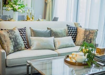 Elegantly decorated modern living room with plush seating and chic decor