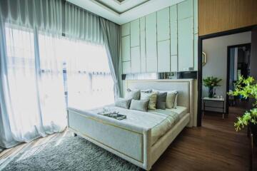 Elegant bedroom with large windows and modern design