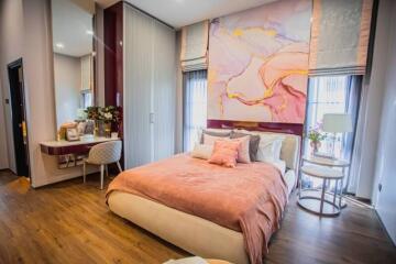 Elegant bedroom with stylish decor and artwork