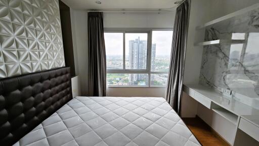 Modern bedroom with city view and elegant interior design