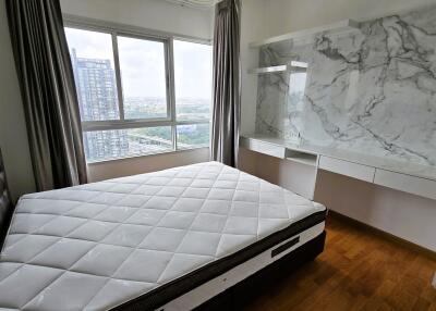 Modern bedroom with city view and elegant design