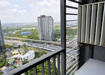 Modern balcony with urban view and laundry facilities